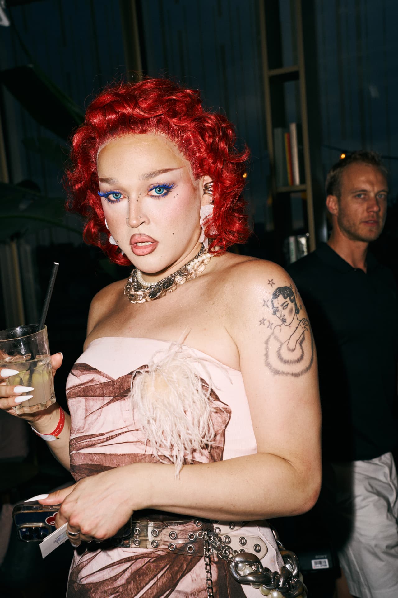 Guest with red hair, blue eyes and heavy jewellery
