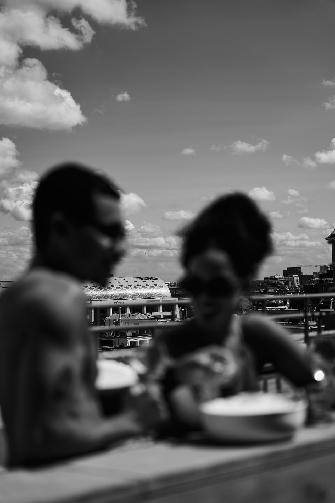 Black and white frame of two guests on the terrace