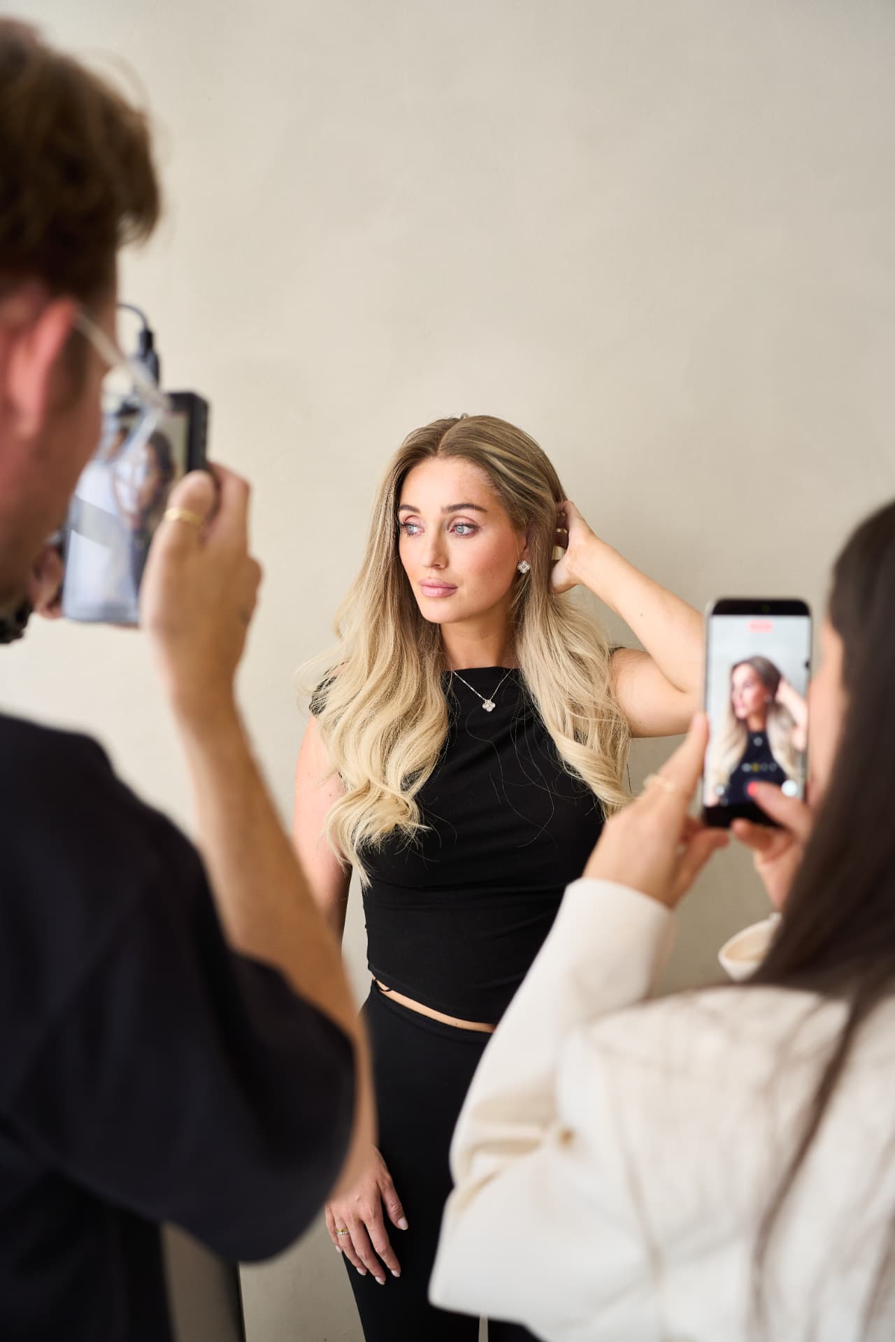 Behind the scenes: crew filming a model on set