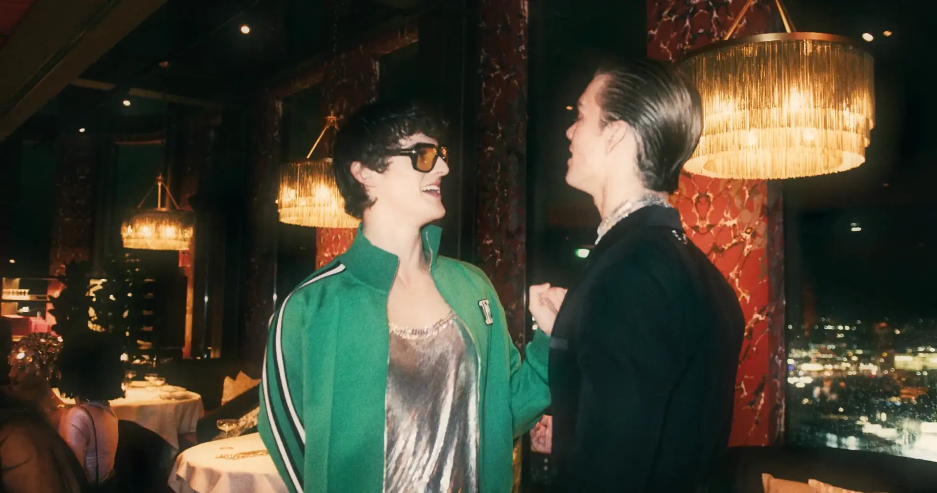 Guests in conversation in the warmly lit event space
