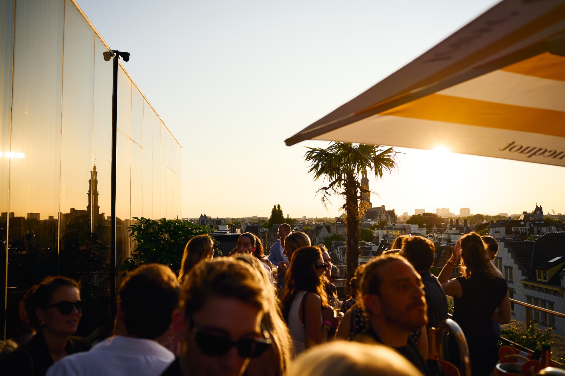 Crowd on the rooftop at sunset