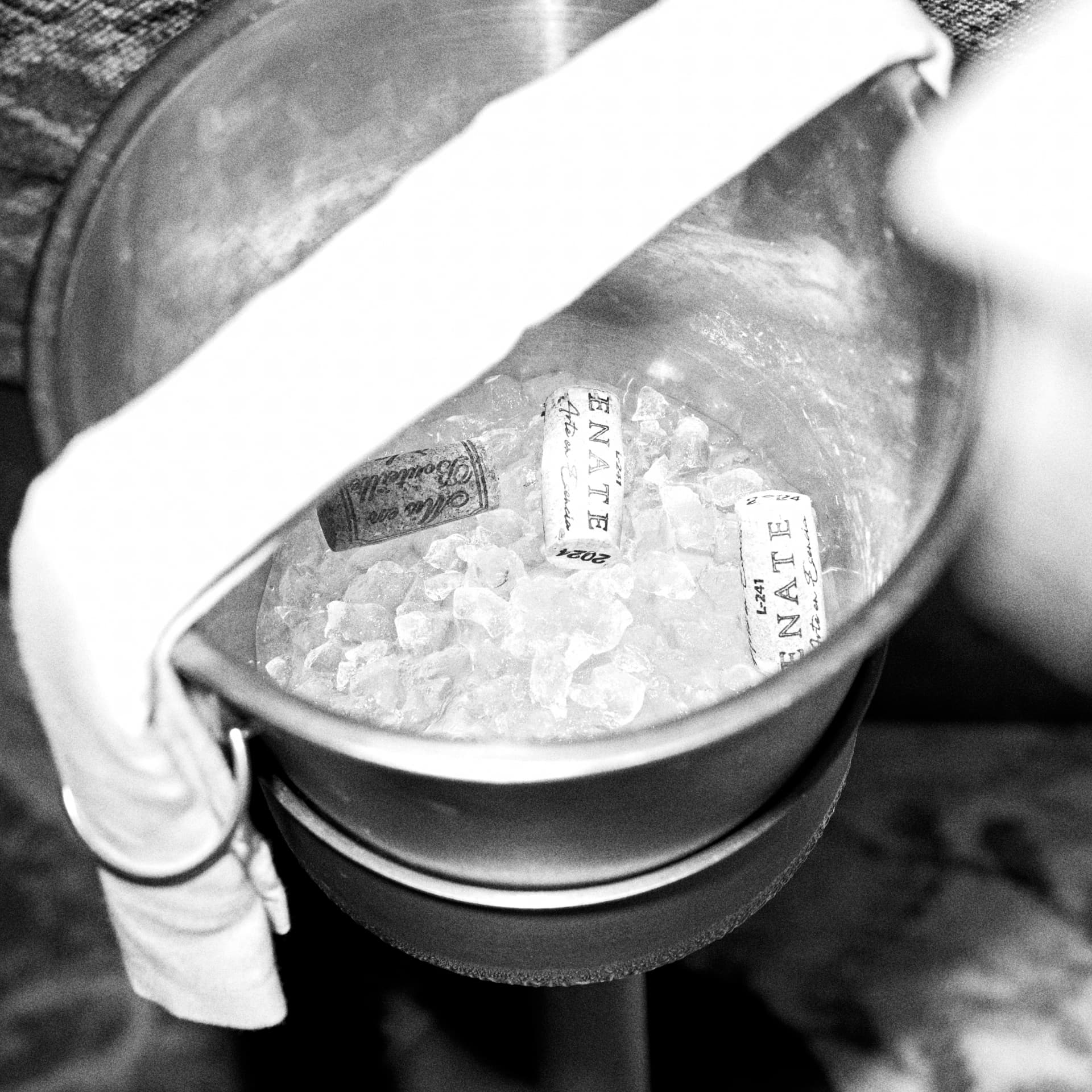 Black and white shot of corks in an ice bucket