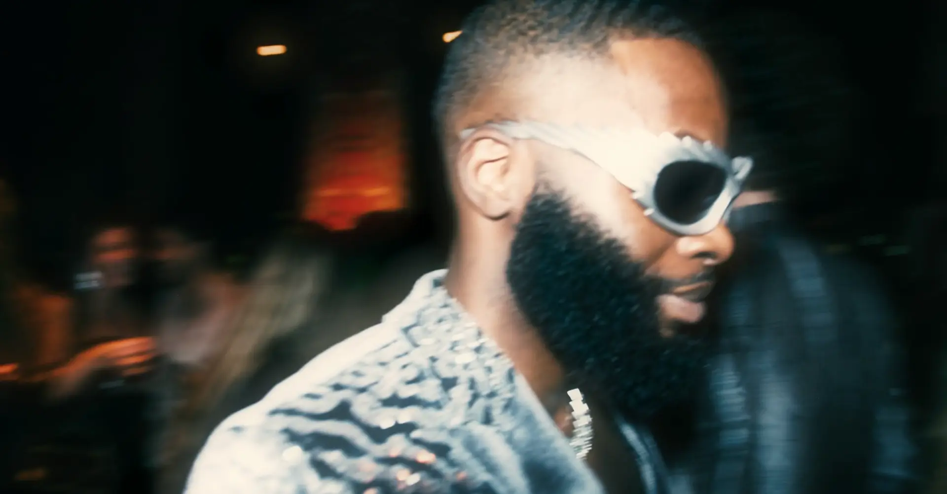 Guest wearing white sunglasses at the evening event