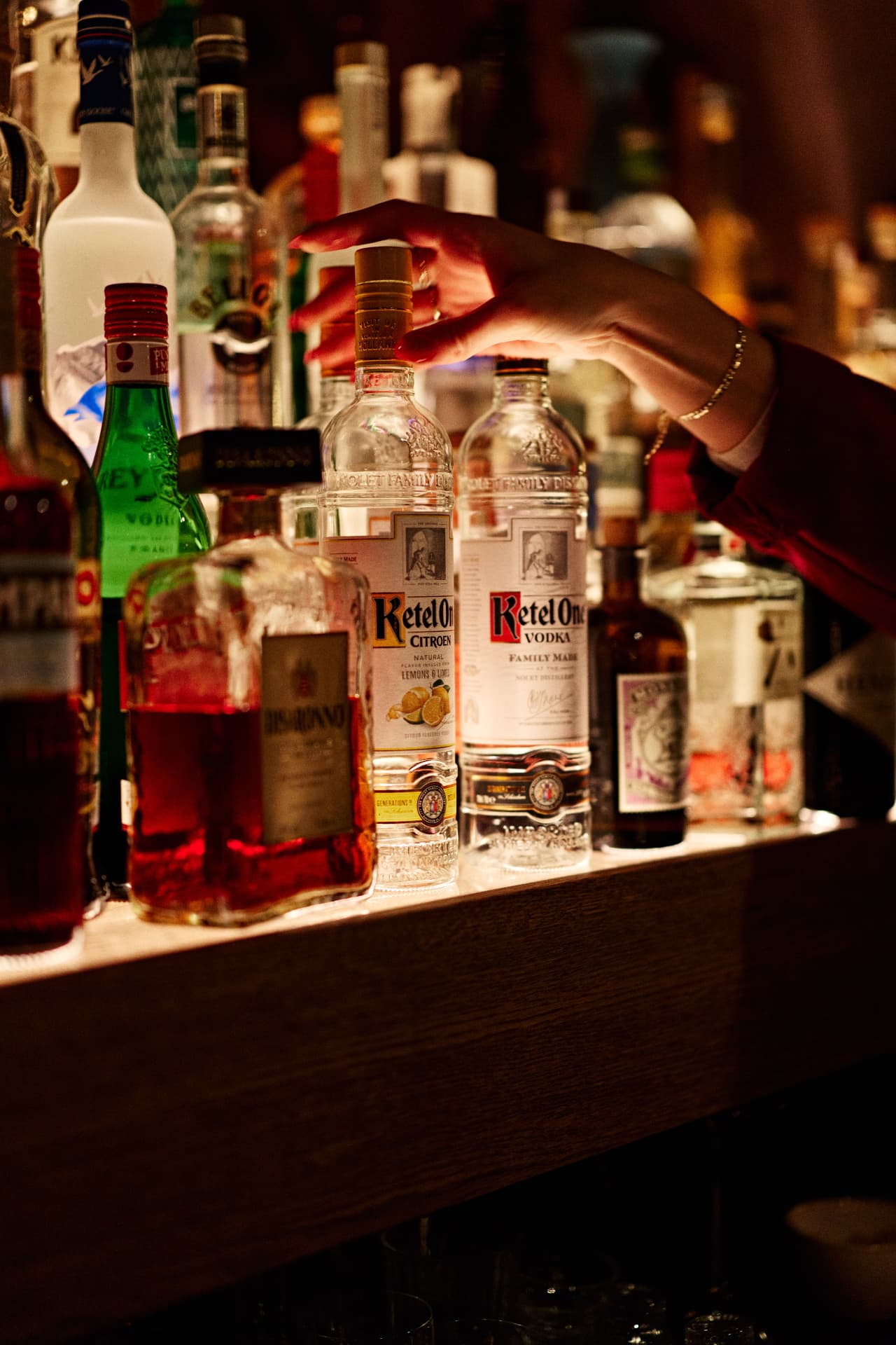 Ketel One bottle and cocktail preparation at the bar