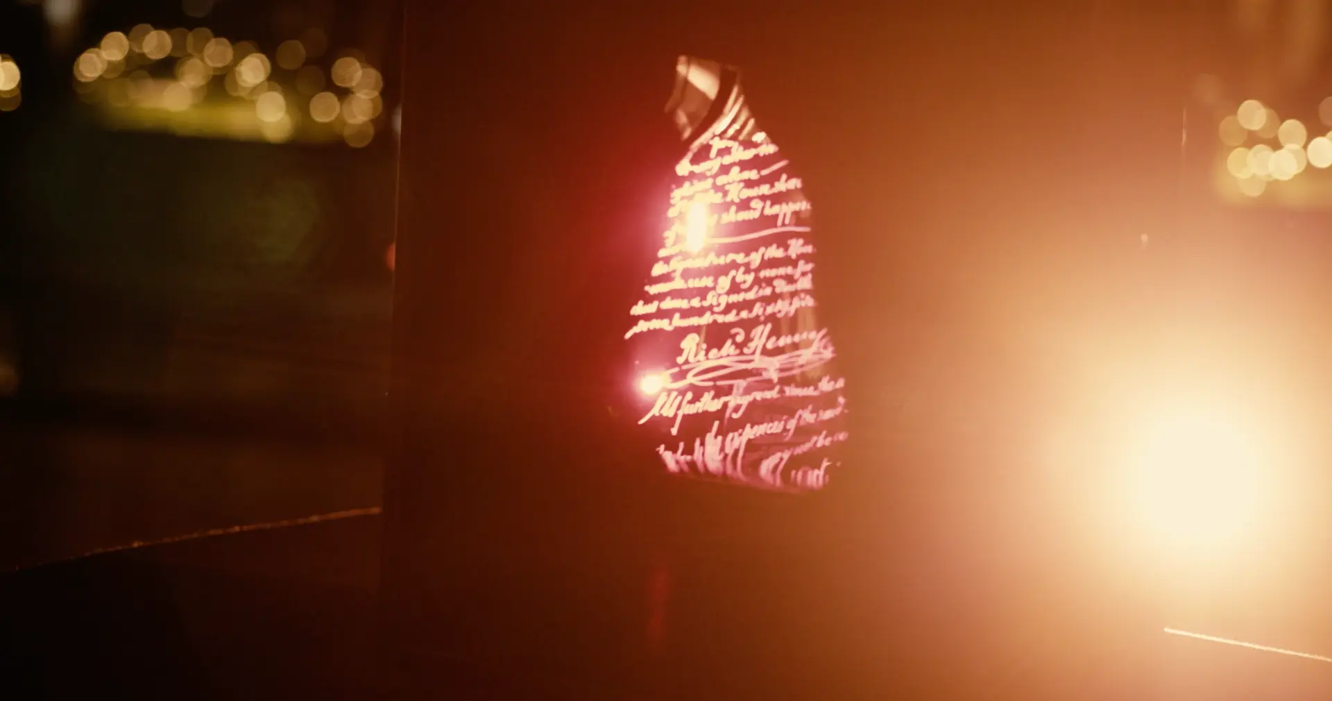 Light revealing lettering in a Richard Hennessy installation