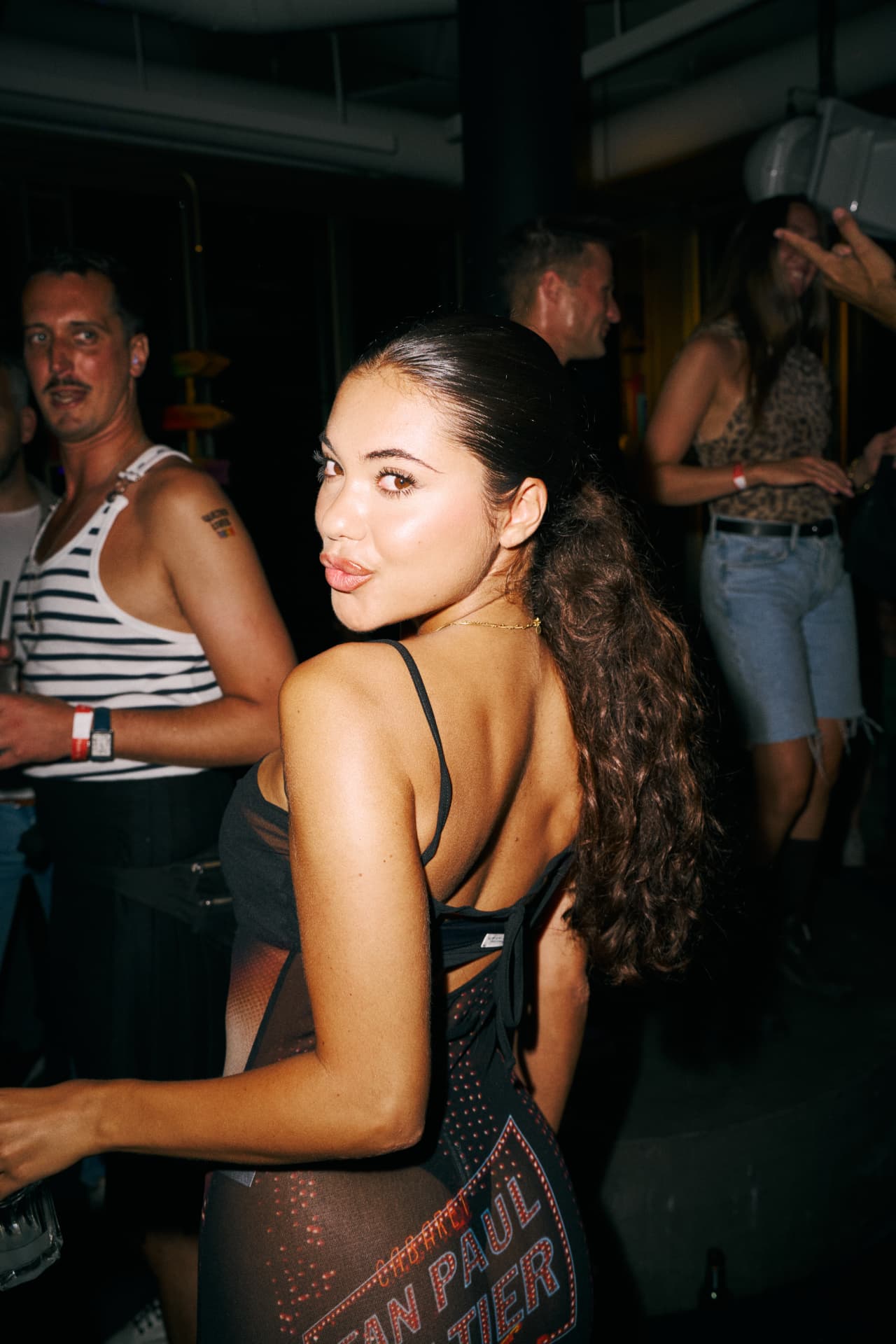 Guest looking back over her shoulder in a printed dress