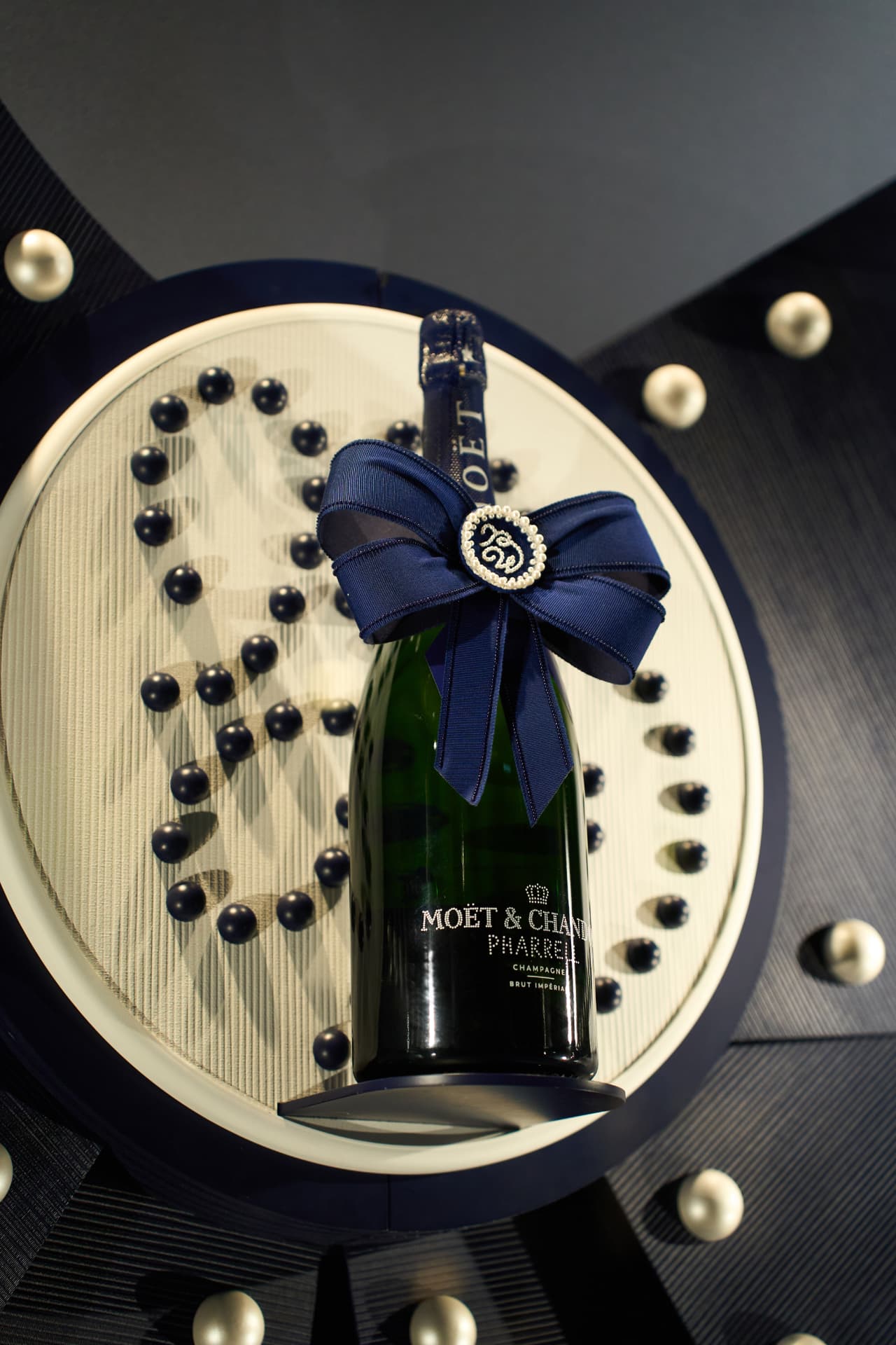 Pharrell edition bottle on the pearl display