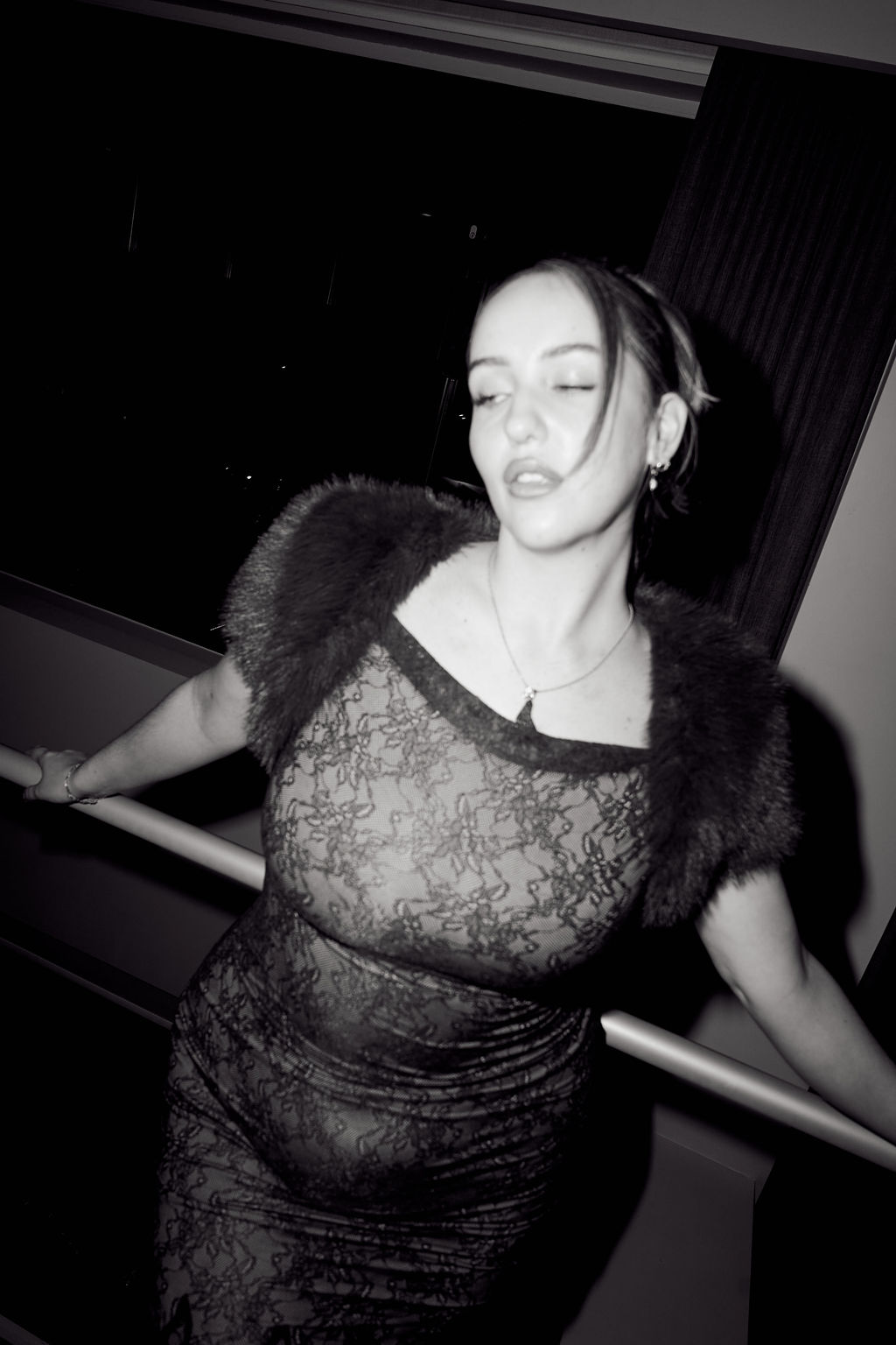 Guest on the stairwell in a lace dress, black and white
