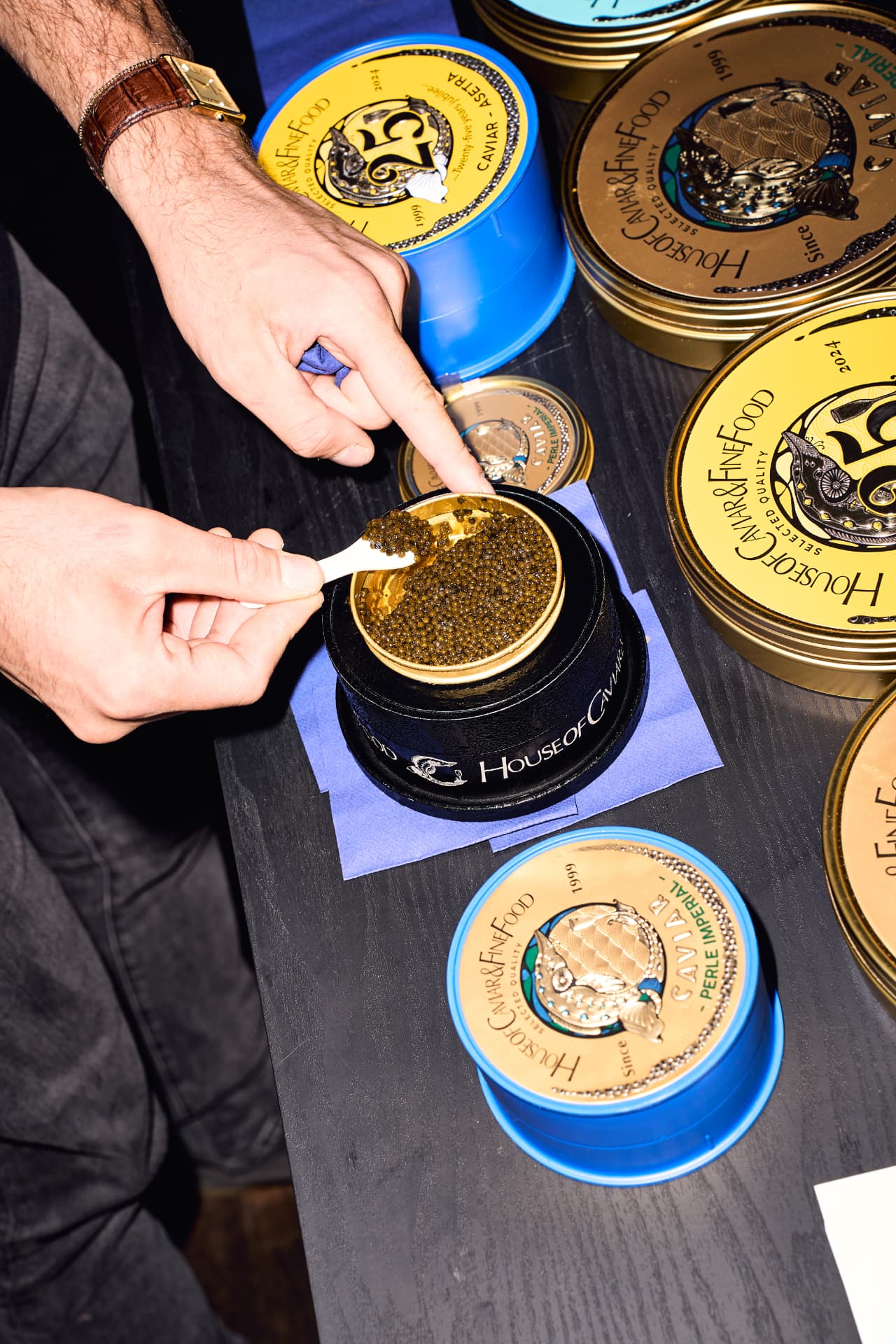 House of Caviar tins opened tableside