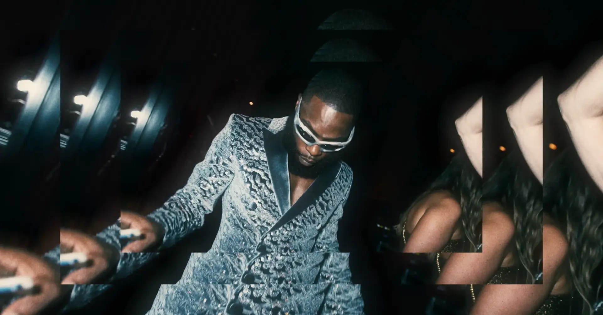 Guest dancing in a patterned outfit at the party