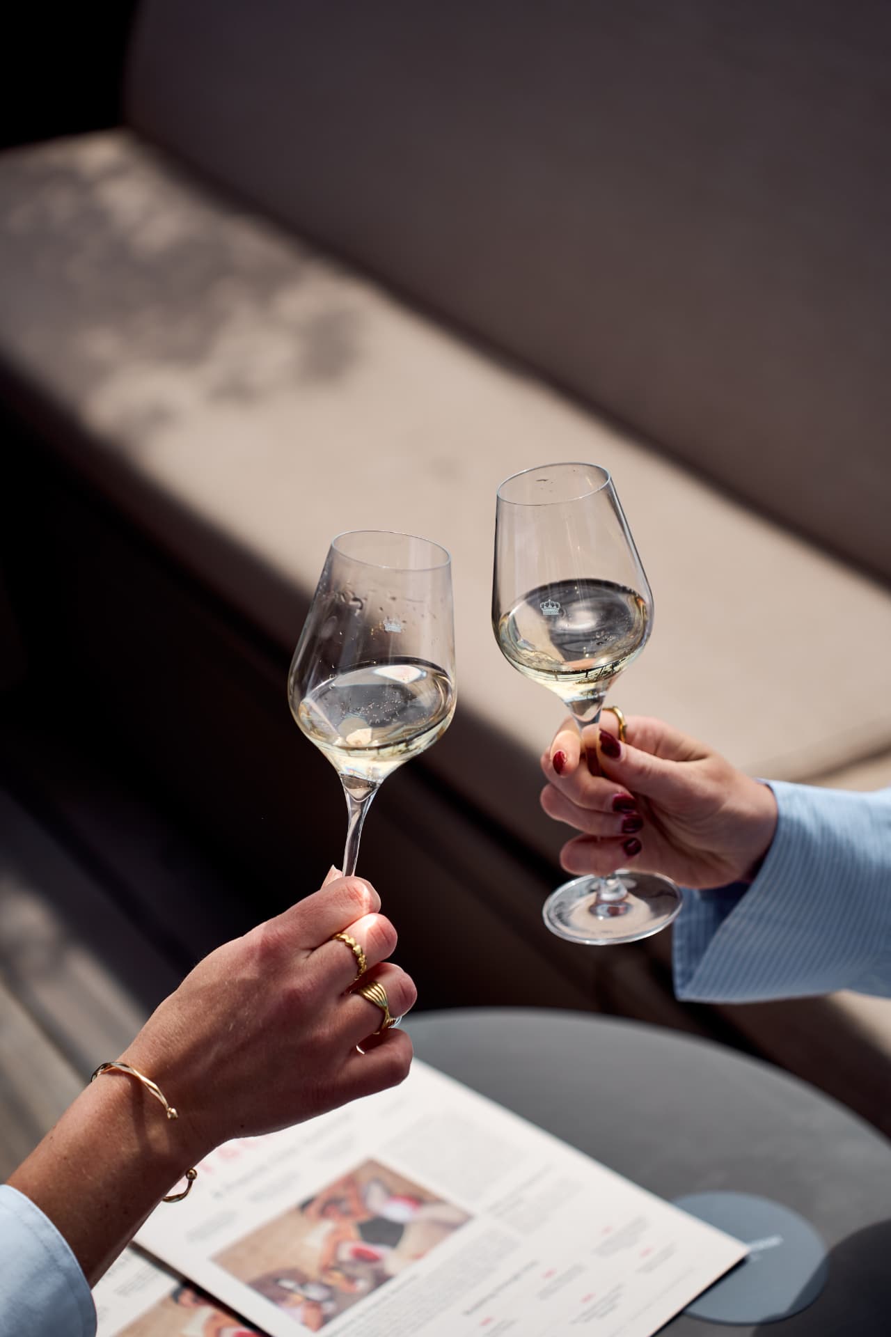 Two glasses meeting in the sun