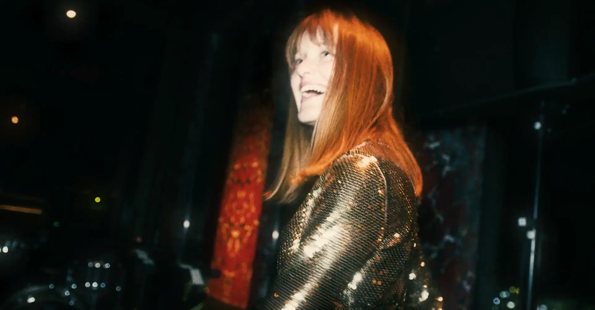 Guest in a shimmering gold outfit at the party