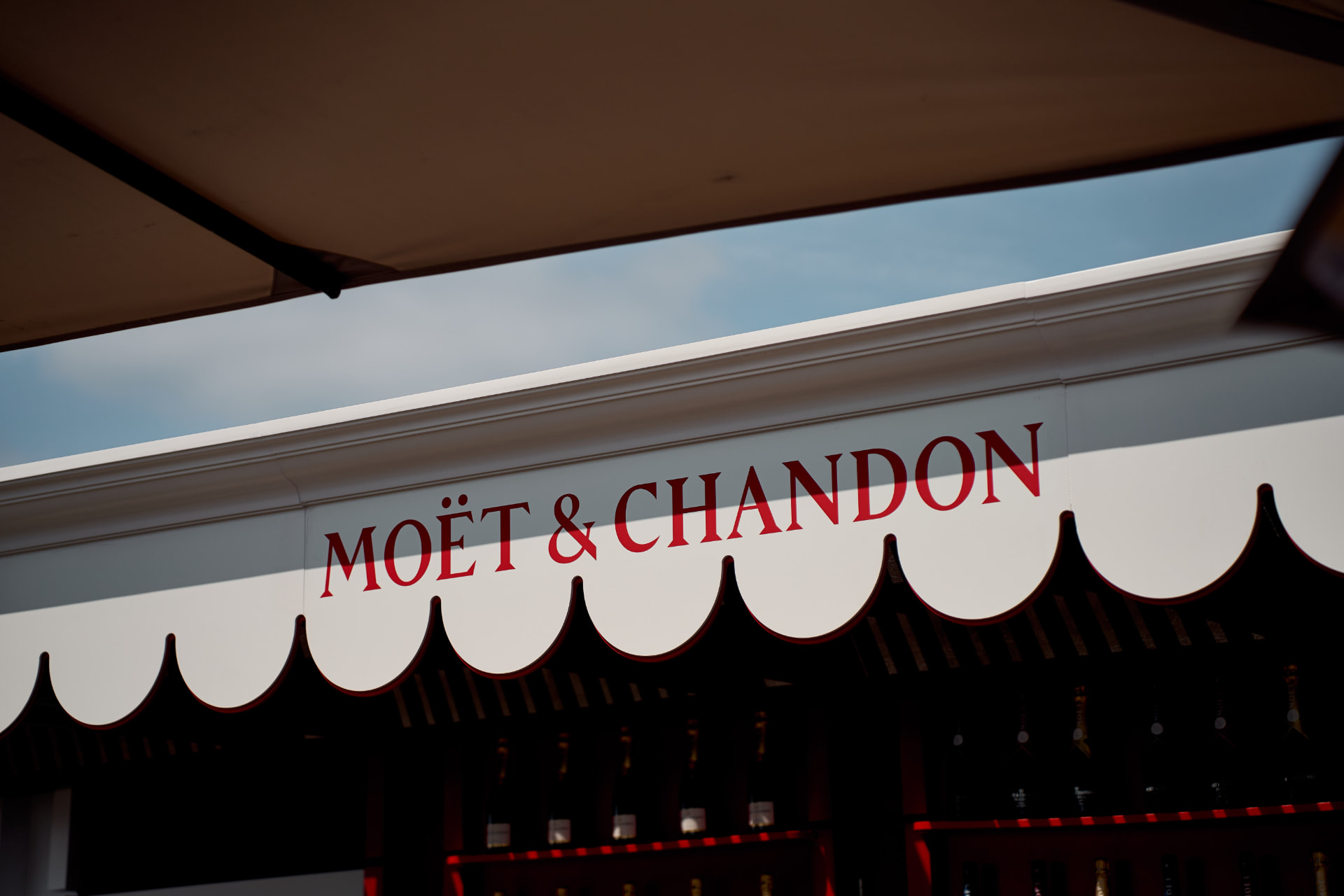 Scalloped Moët & Chandon awning against the sky