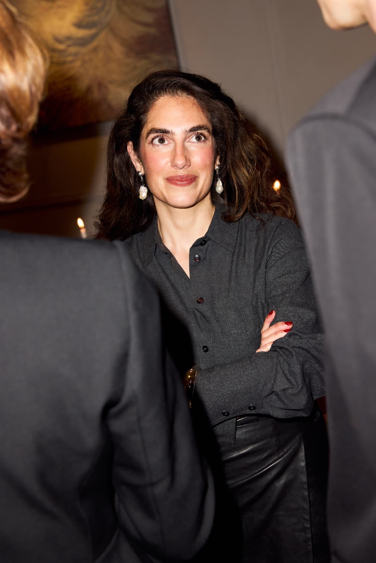 Guest smiling during the evening at Mia Karlova Gallery