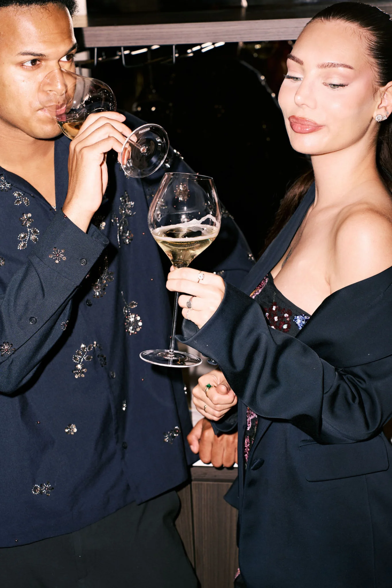 Two people sharing a moment with BaoMao wine glasses