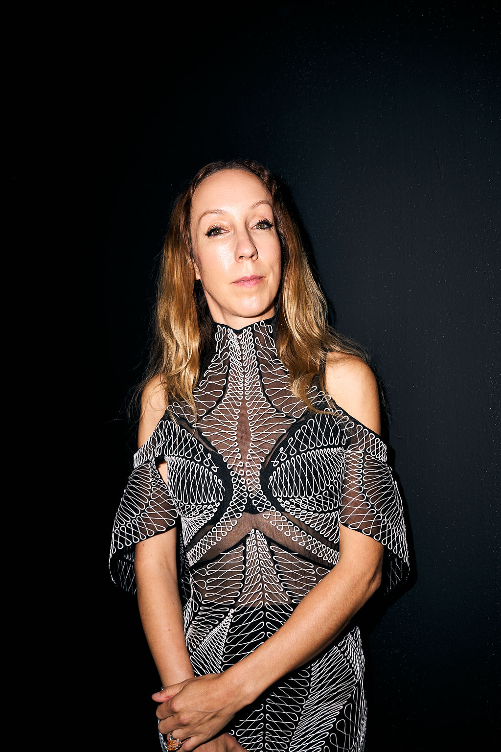 Portrait of Iris van Herpen against a black wall