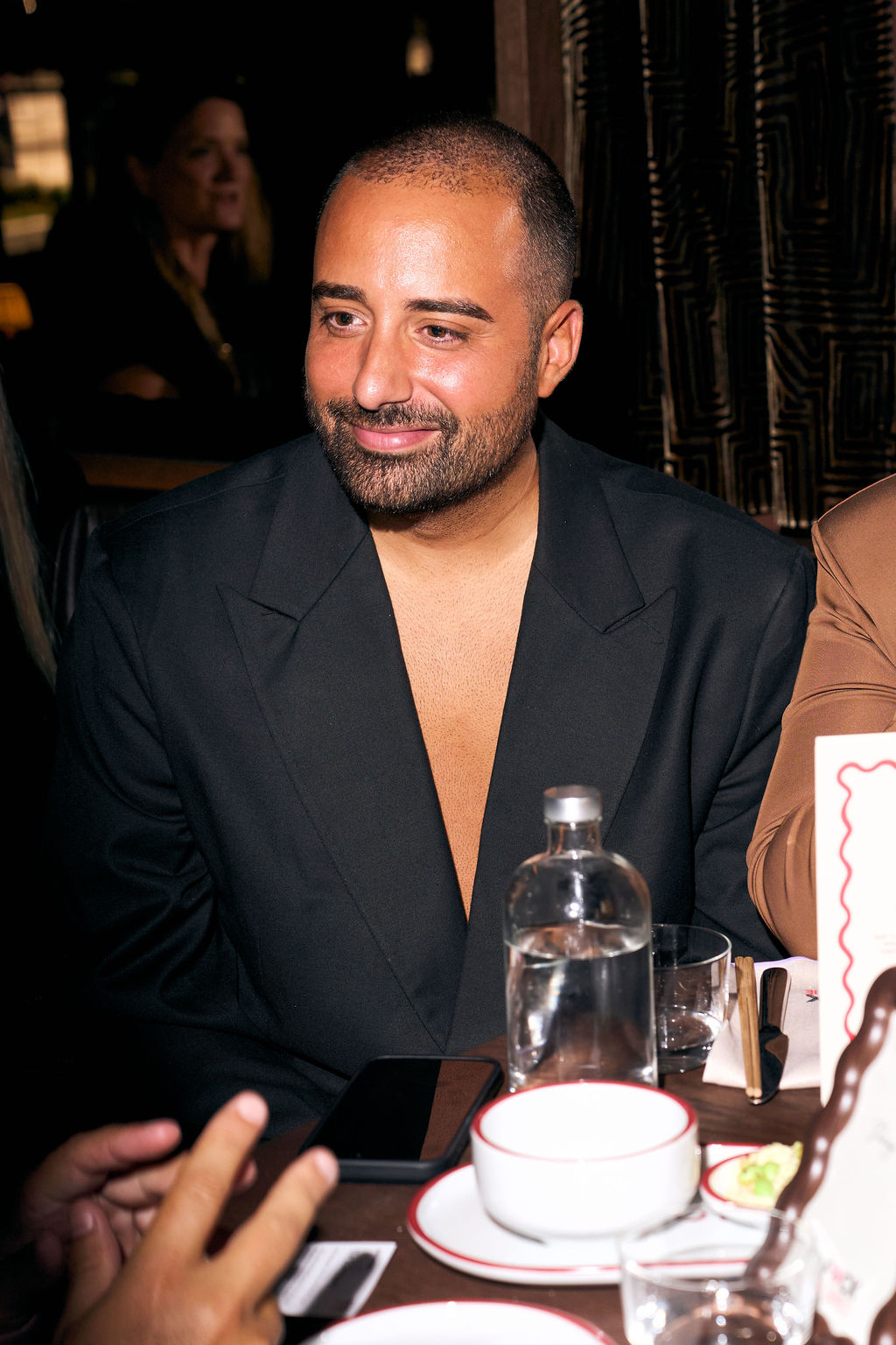Farja Farvadin in an open black blazer at the premiere dinner