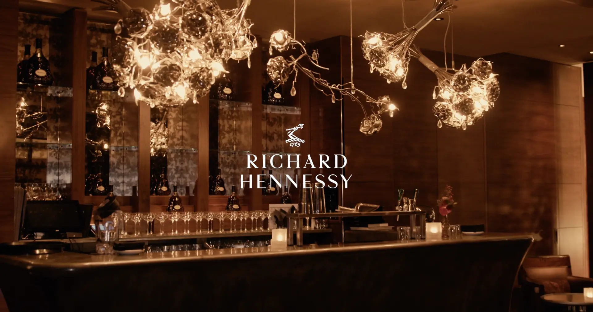 Richard Hennessy dinner space with sculptural chandeliers