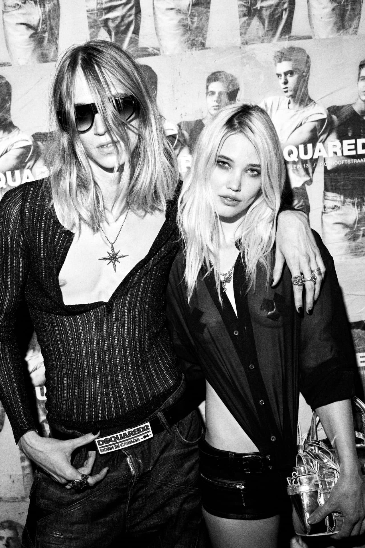 Two guests in DSQUARED2 against the poster wall, black and white