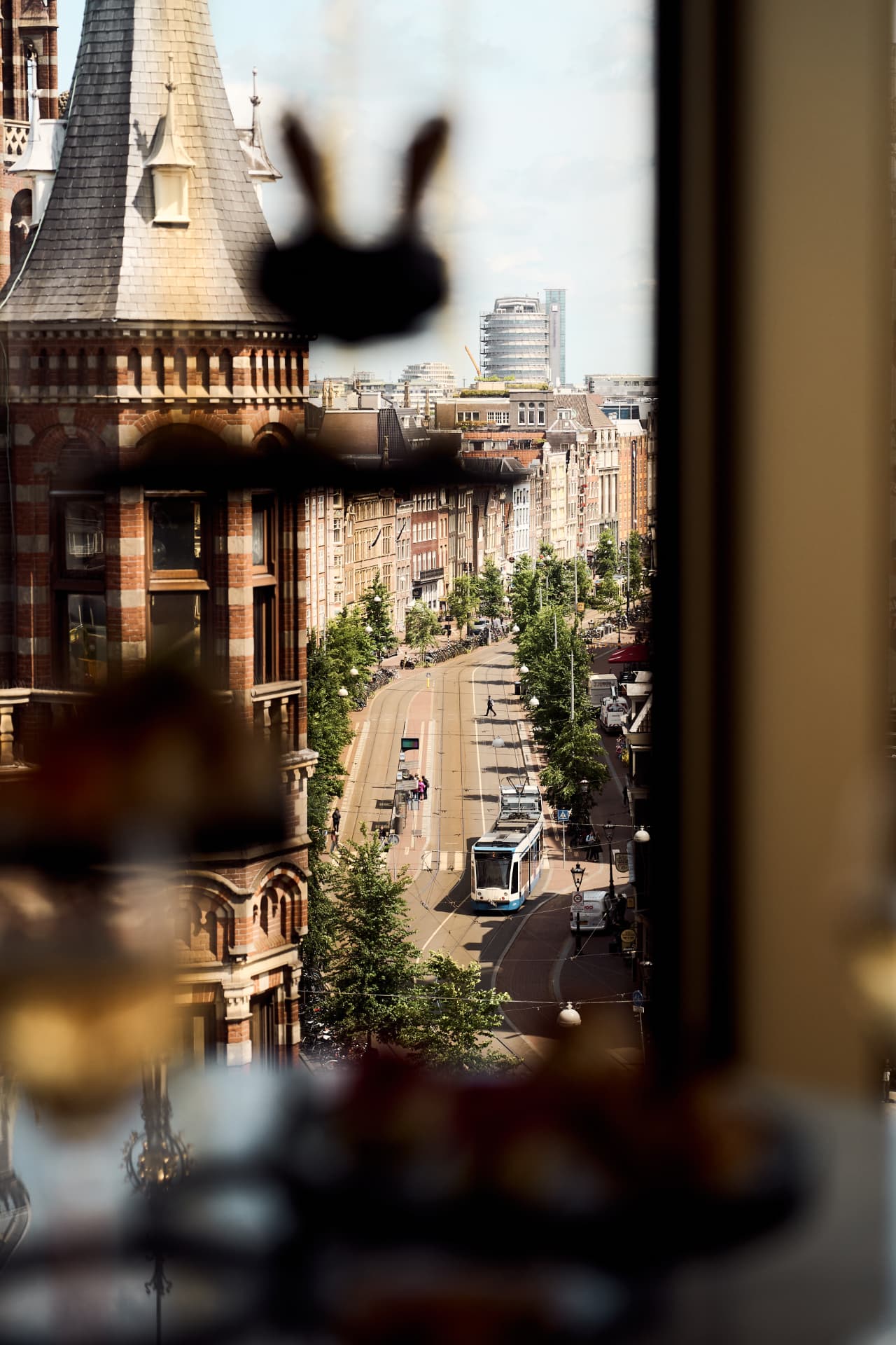 Amsterdam street and tram framed from the terrace