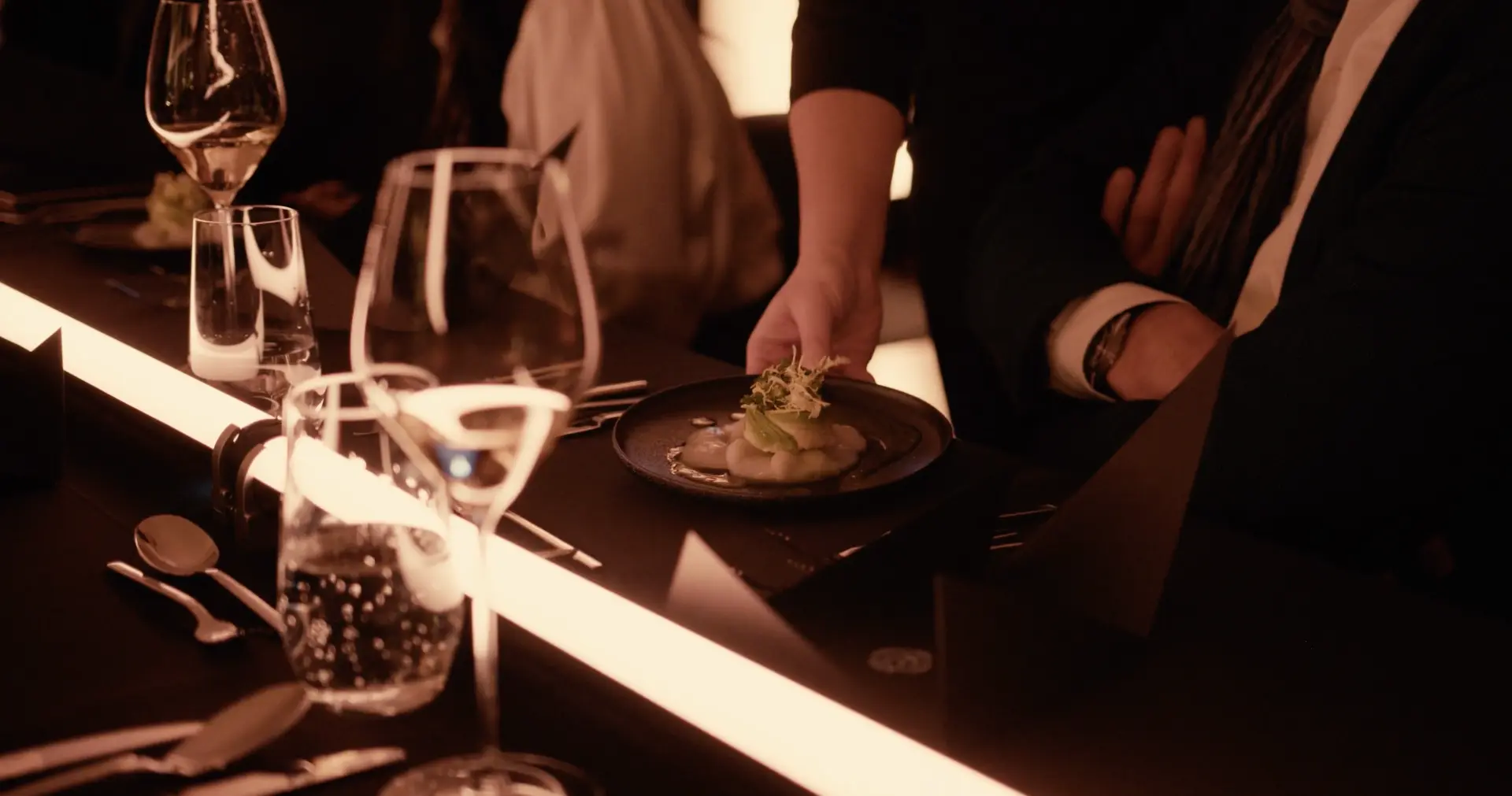 A dish served at the illuminated dinner table
