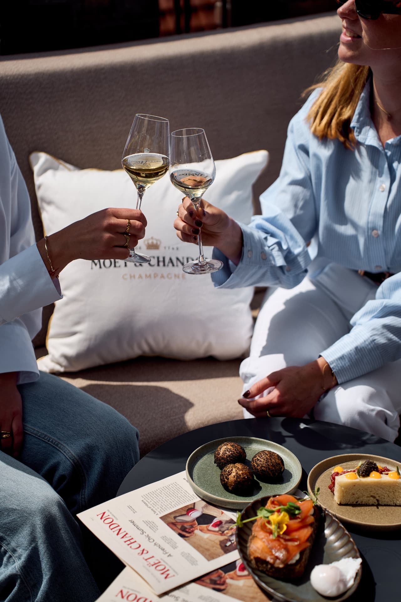 Toast beside a branded cushion and small plates