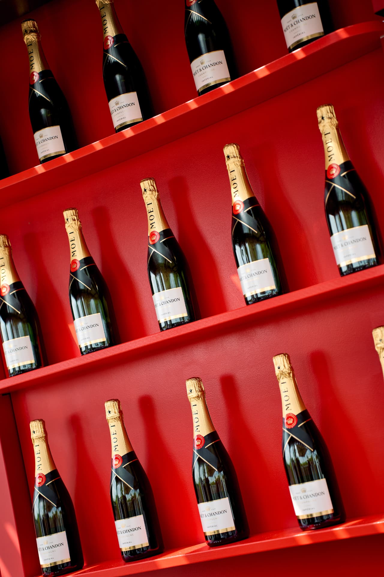 Moët & Chandon bottles on red display shelves