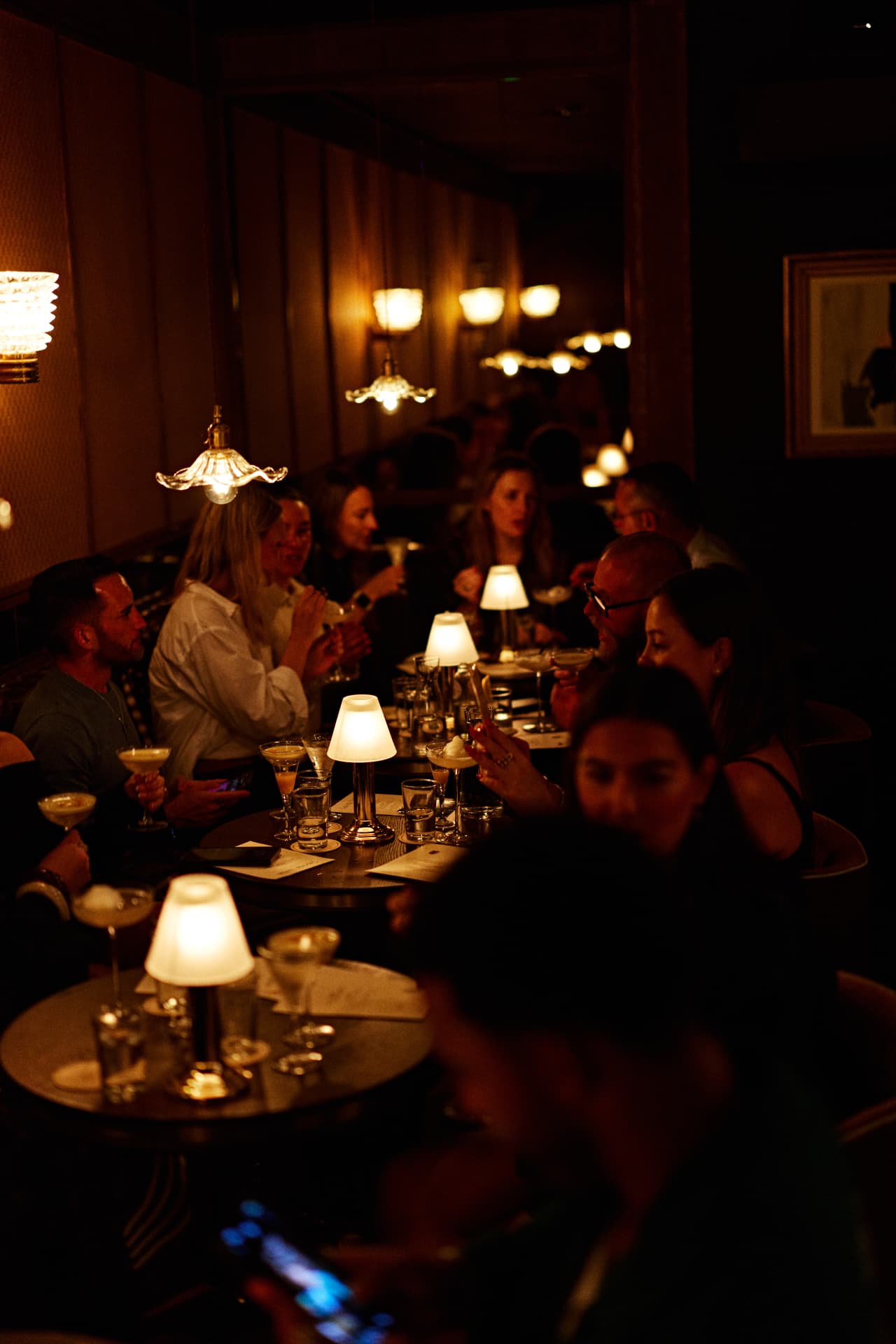 Guests gathered around candlelit tables