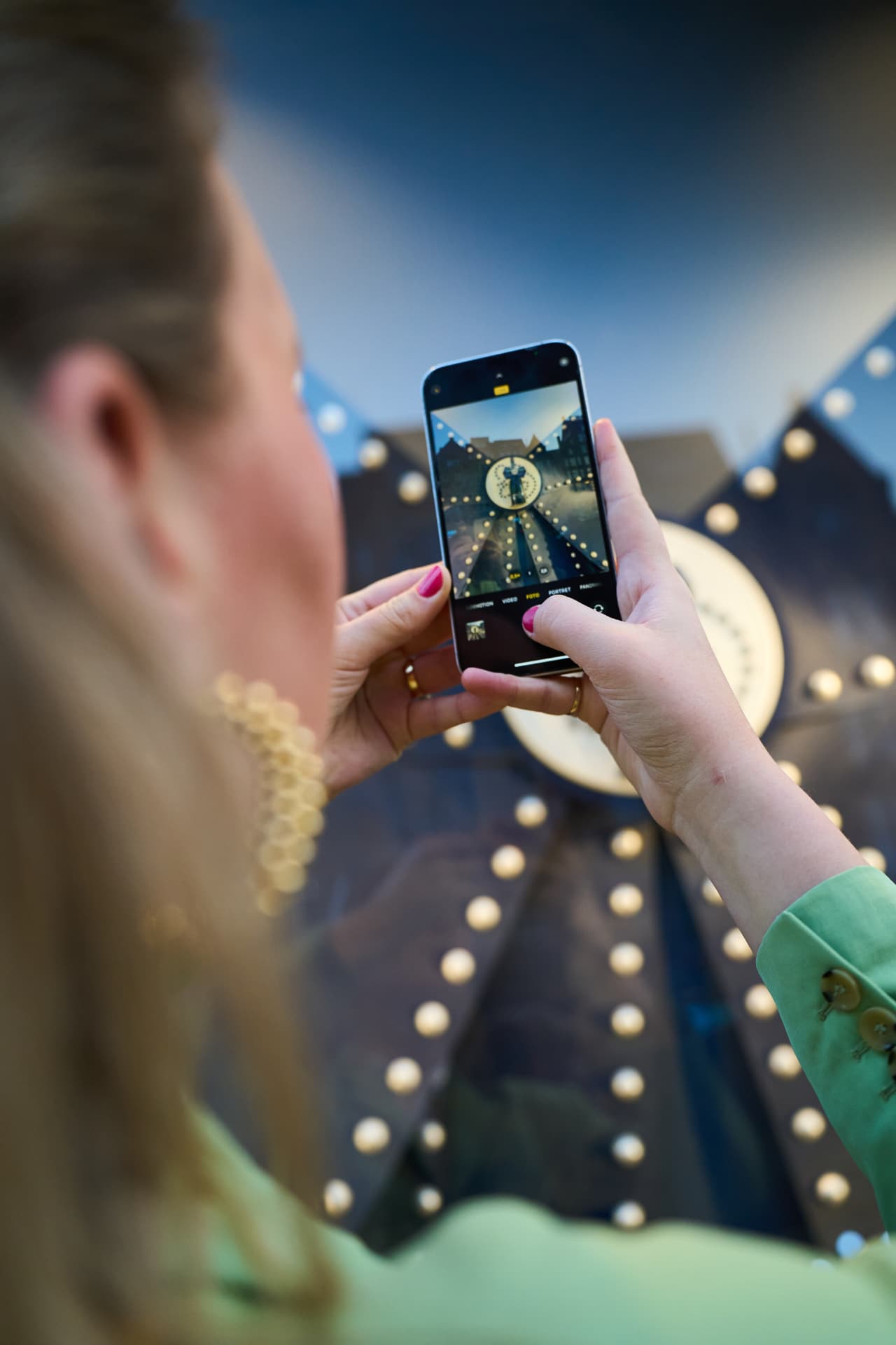 Guest photographing the window on her phone