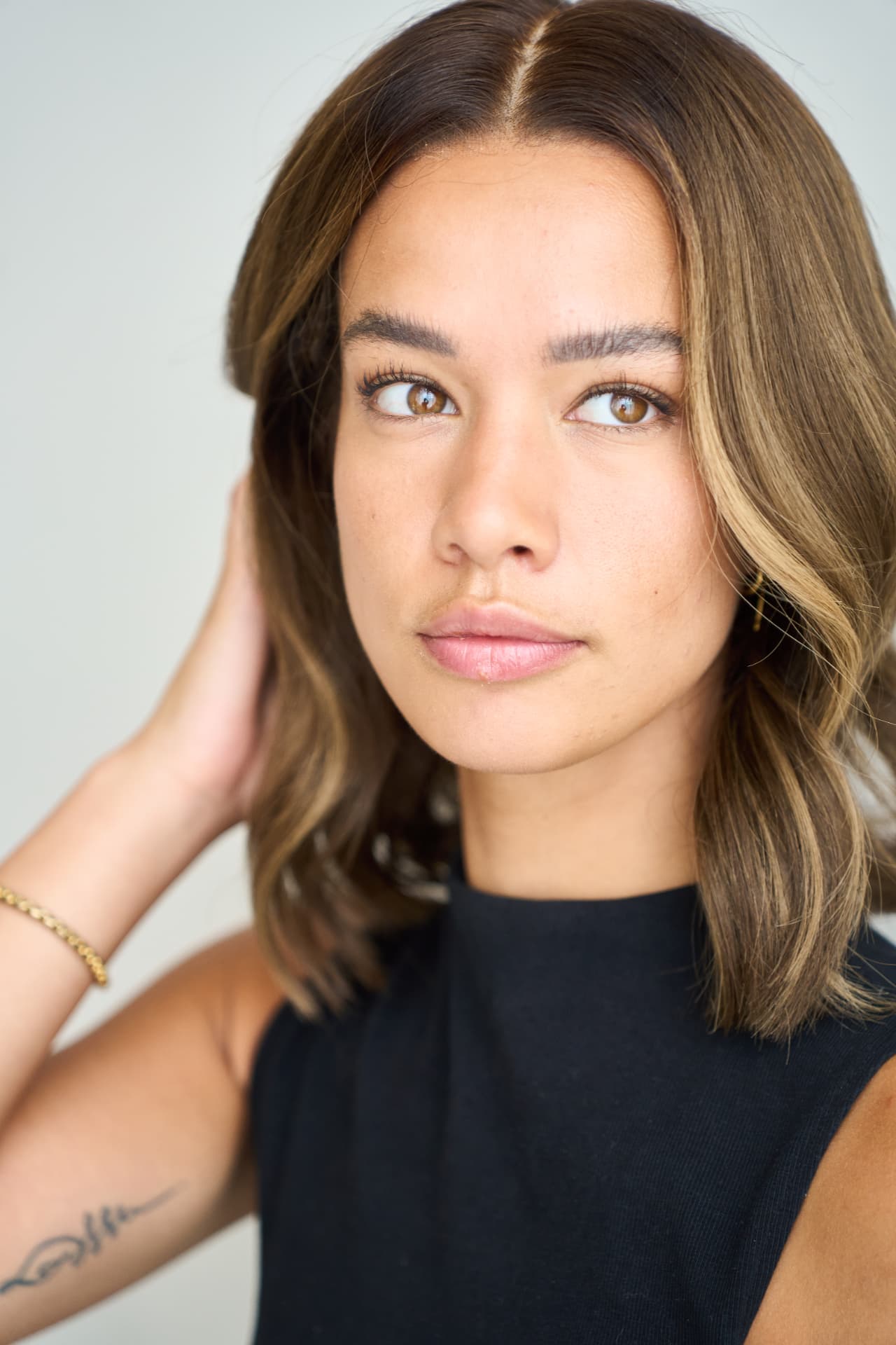 Portrait of a model with a soft brown bob