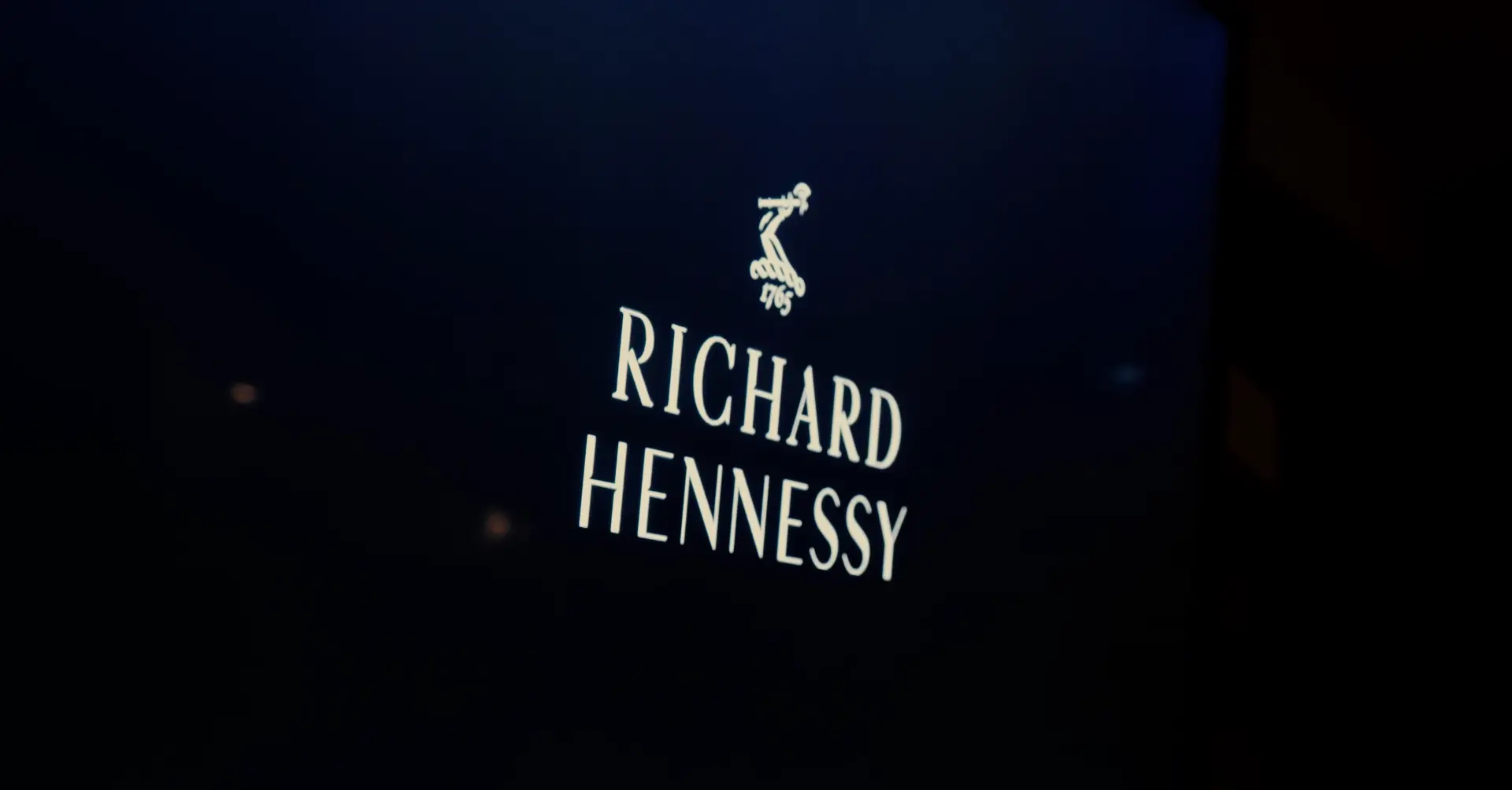 Richard Hennessy signature on a dark backdrop
